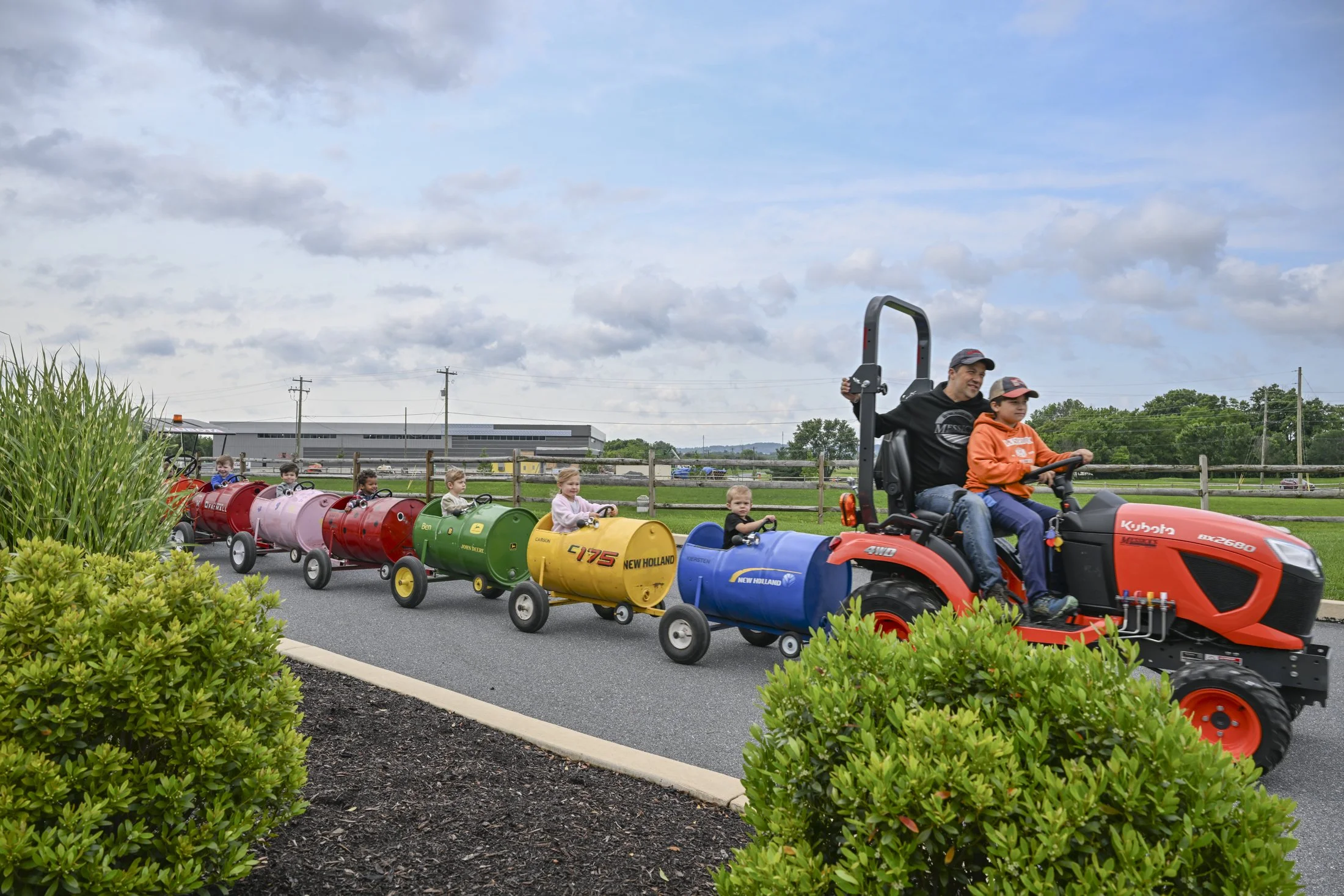 Children enjoy a tractor train ride at the Messick Farm Equipment "Touch A Tractor" event.