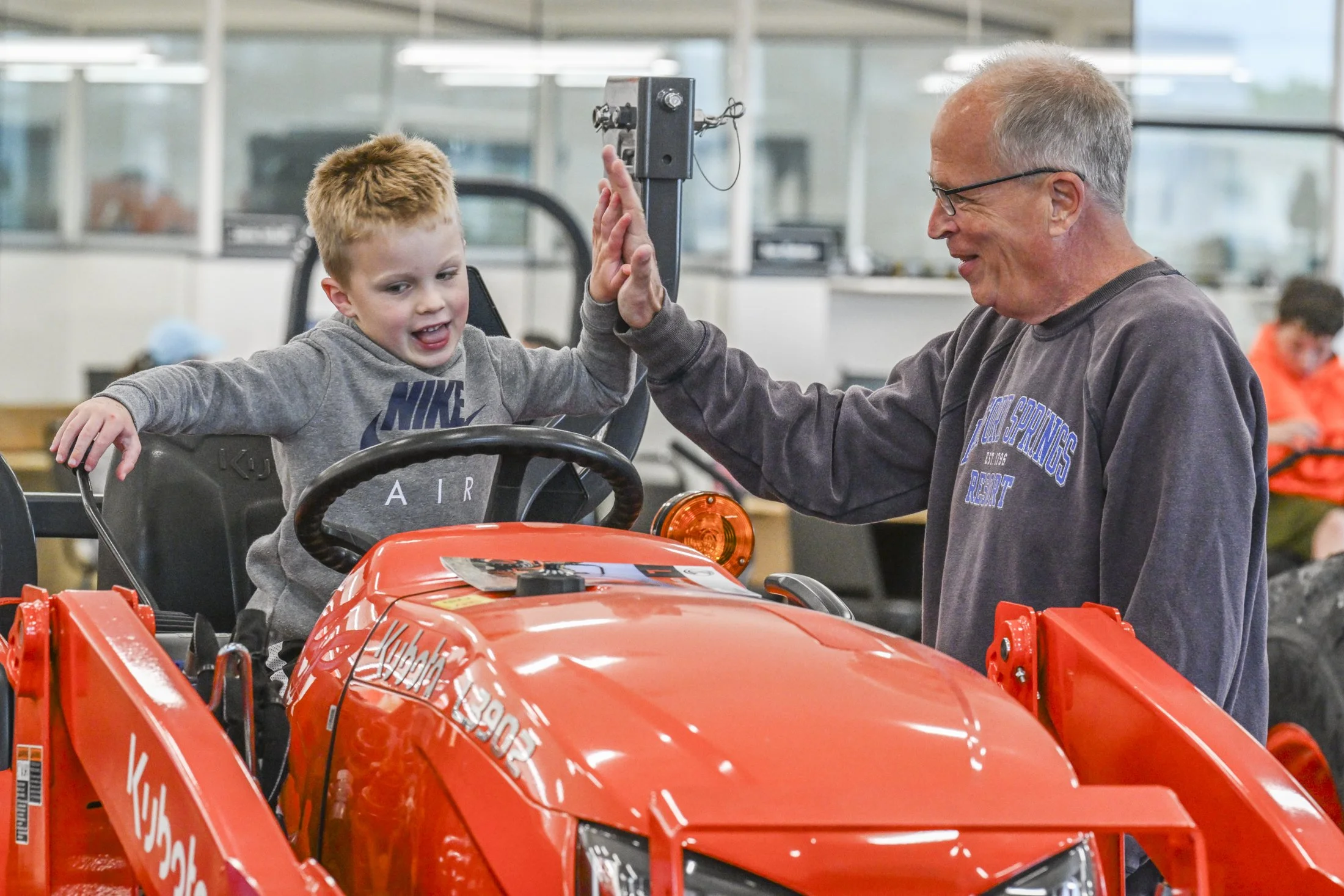 John Krulock of Mount Joy gives his grandson John a high-five.