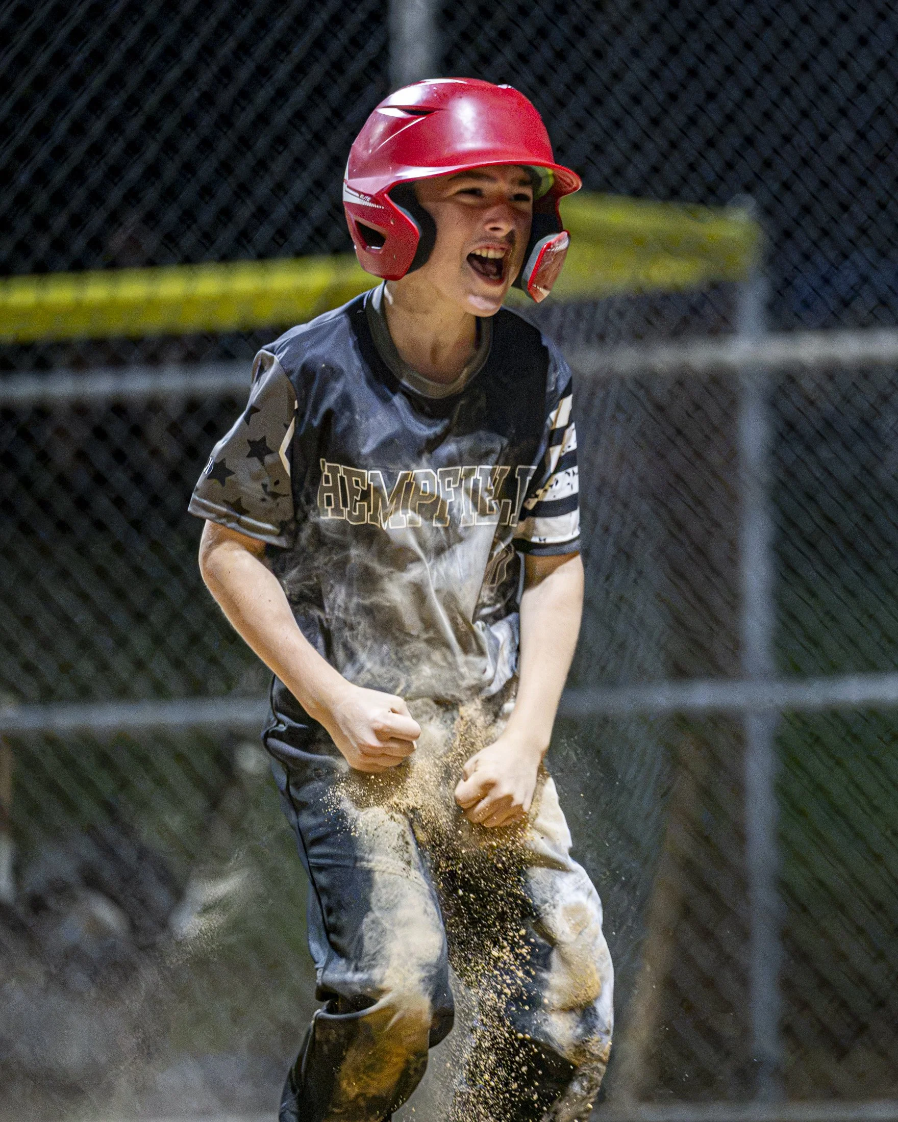 Dean Greinermiller of Hempfield dusts himself off after scoring during the LNP 12U tournament game between the MT Streaks and Hempfield Black.