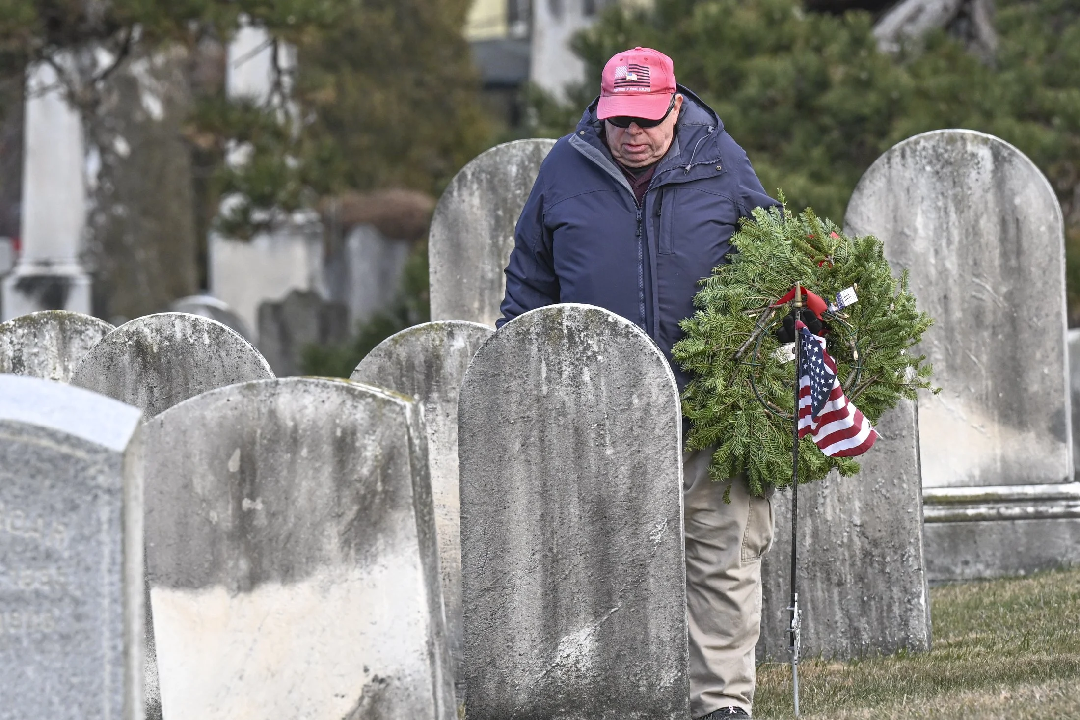 Patrick J. of Gap, PA pays his respects to a veteran at Bellevue Presbyterian Church. Family, friends and volunteers laid wreaths on every veteran grave as part of Wreaths Across America on Saturday, Dec. 13, 2025.