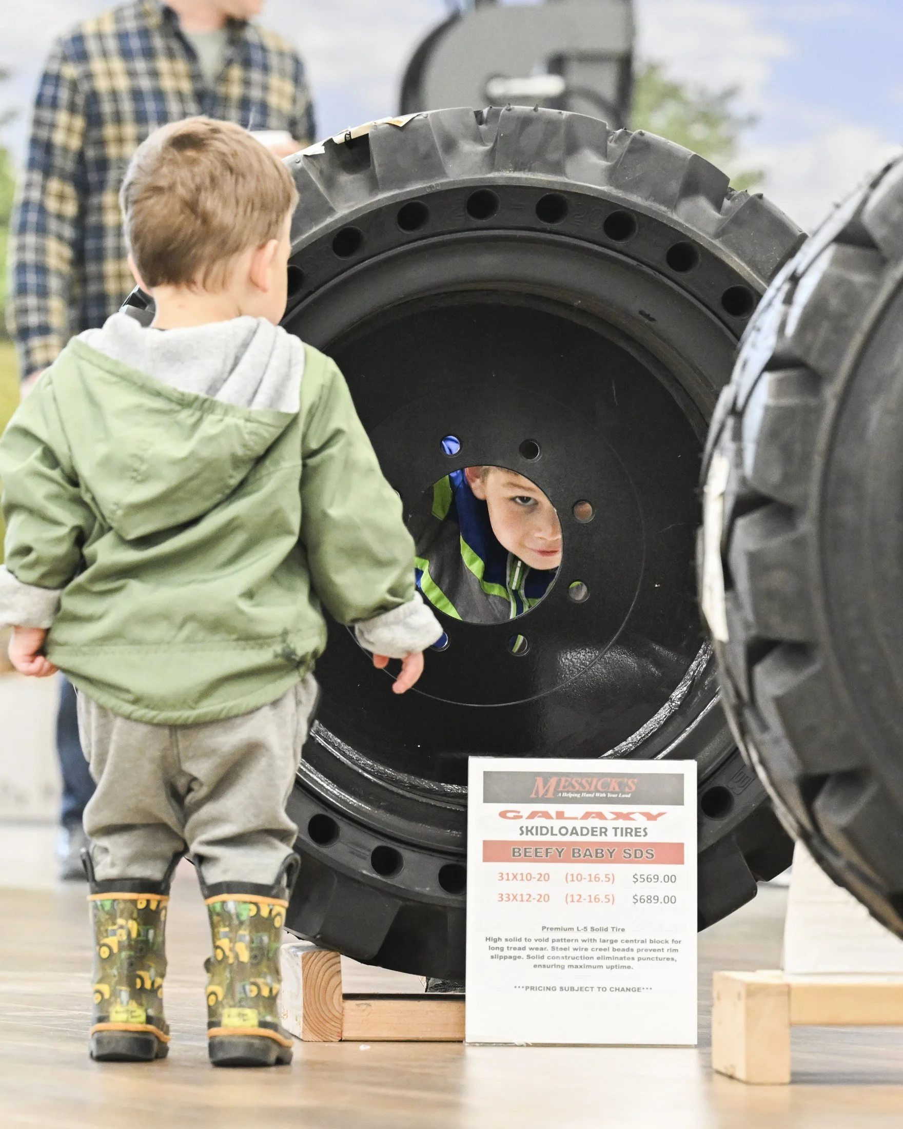 Andre and Emilio of Elizabethtown, PA play in tractor tires at the Messick Farm Equipment "Touch A Tractor" event in Mount Joy on Saturday, May 31, 2025.