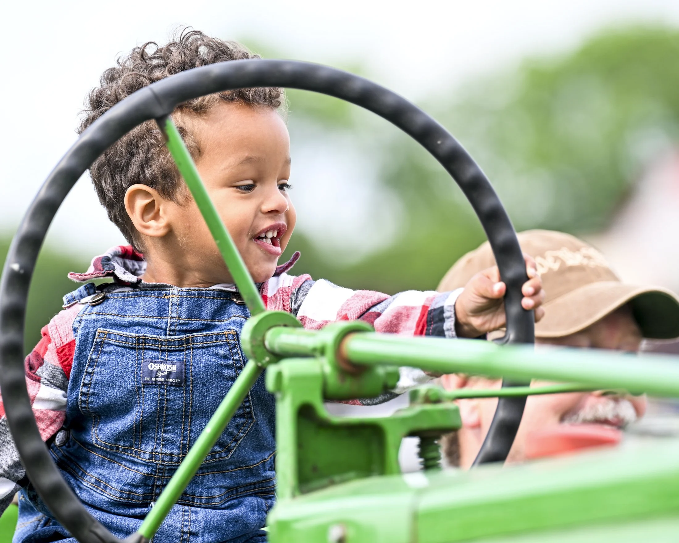 Kaden Burrell of Bainbridge, PA sits on a vintage tractor at the Messick Farm Equipment "Touch A Tractor" event in Mount Joy on Saturday, May 31, 2025.
