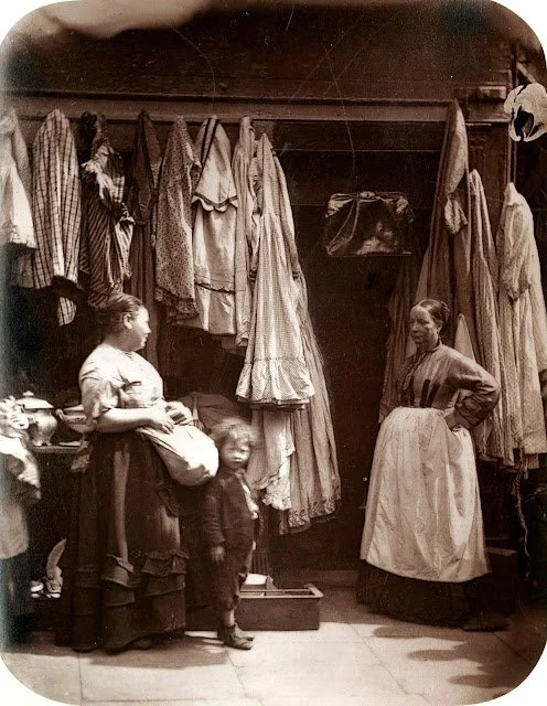"The Old Clothes of St. Giles"
The Victorians were very much into thrifting. Clothes had a continued life through reselling until they were threadbare and picked up by Rag and Bone men. 
Scrooge's best shirt would have a long life after he was gone. 