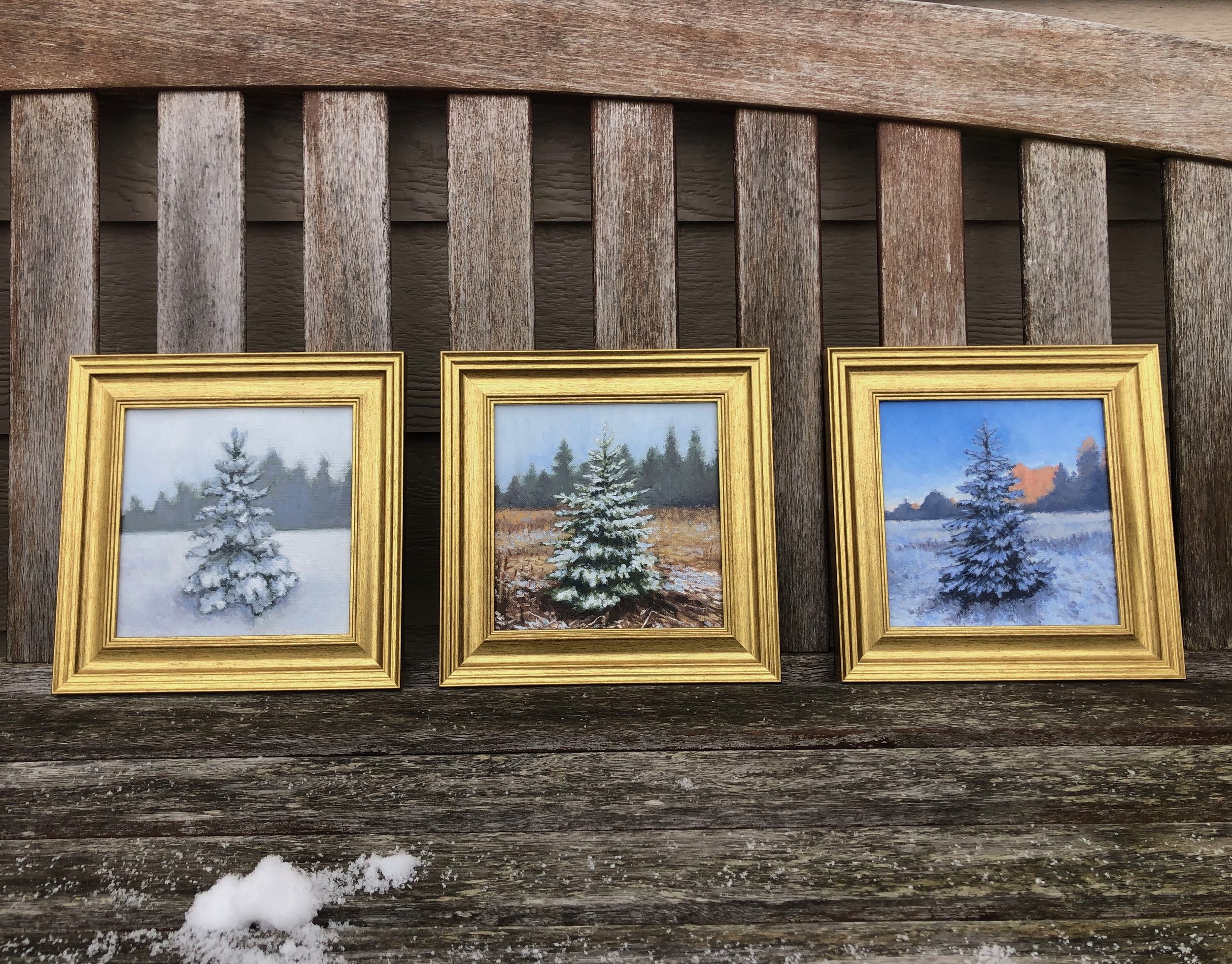 3 snowy trees paintings full shot.jpeg