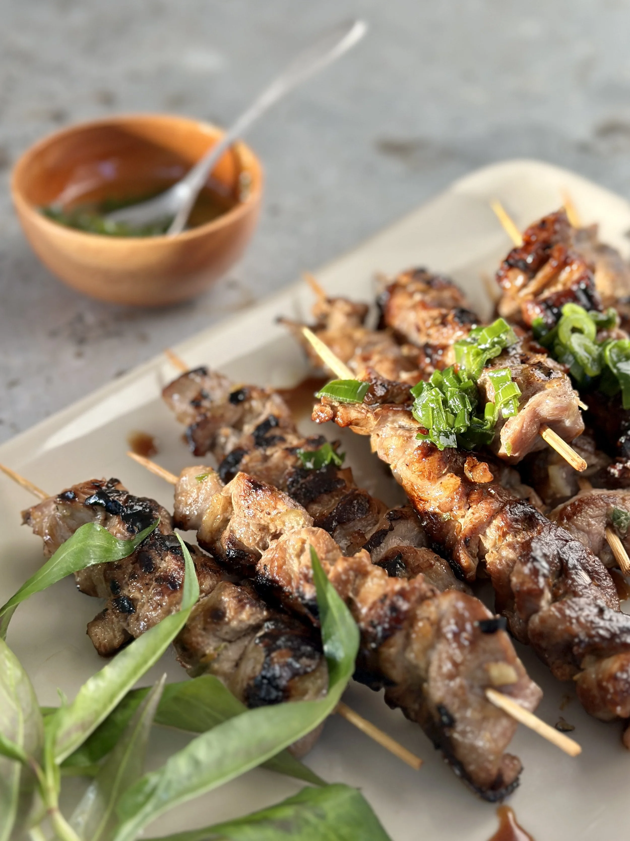 MARINATED GRILLED PORK SKEWERS WITH LEMON GRASS AND SPRING ONION OIL