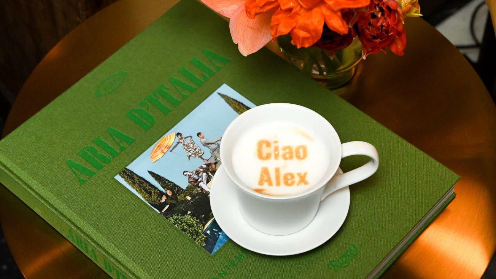 Close-up of a latte with a printed message at a Tod’s event