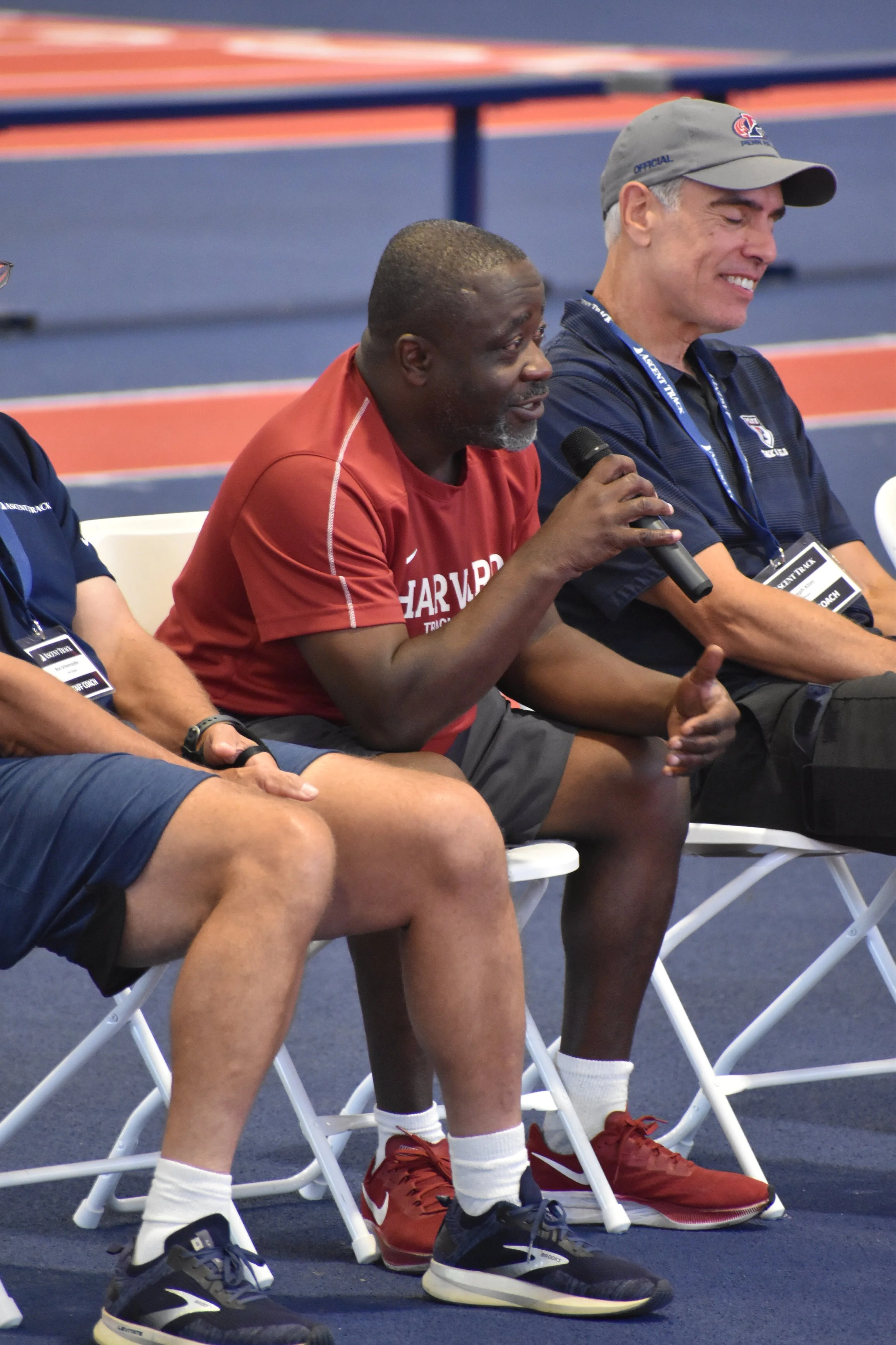 Harvard Associate Head Coach, Kebba Tolbert, speaking at a coach's panel during a day camp at U Penn.