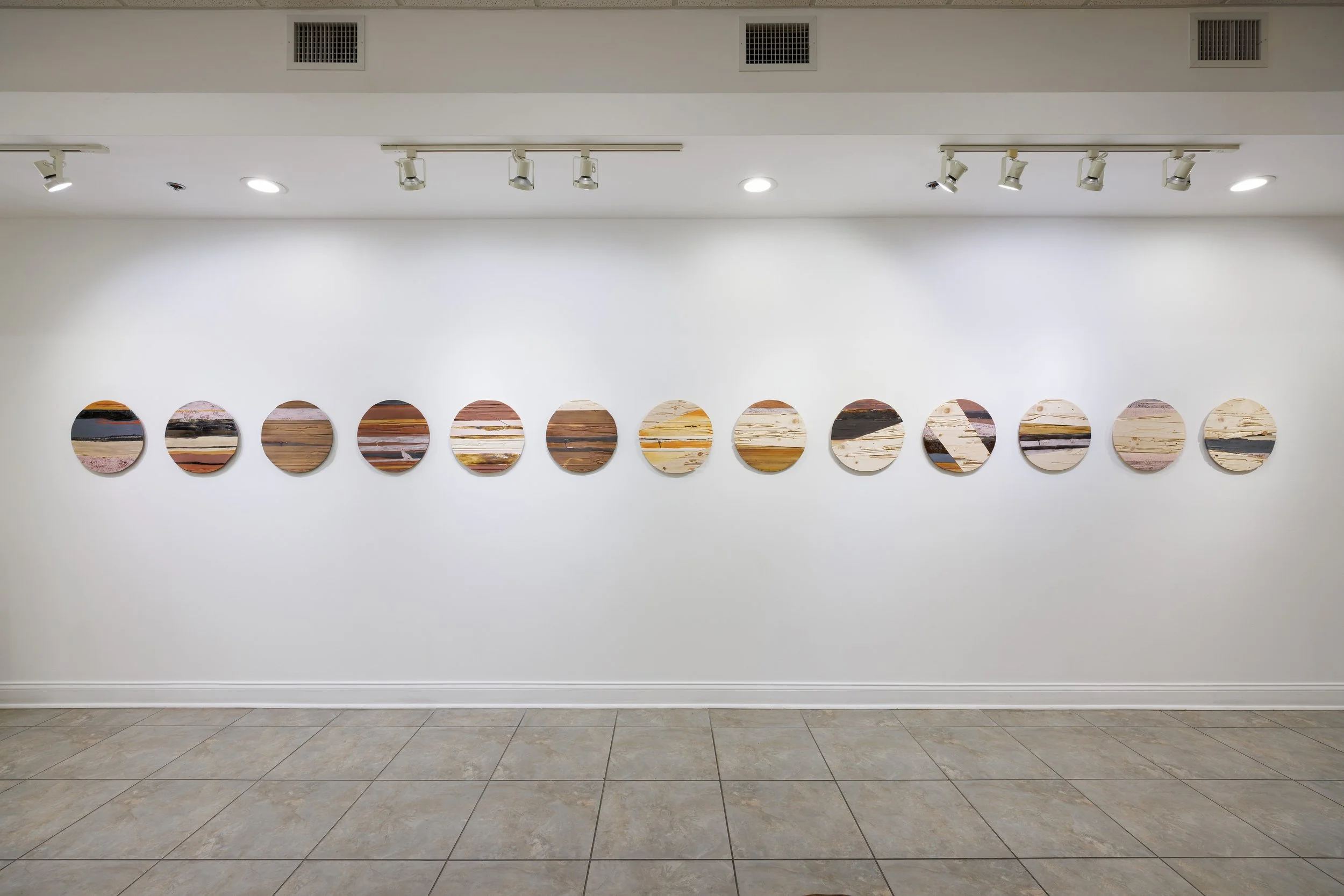 Ceramic reliefs made by pressing termite-eaten wood into clay and glazed with mineral-based colors drawn from the Atacama Desert of Chile.