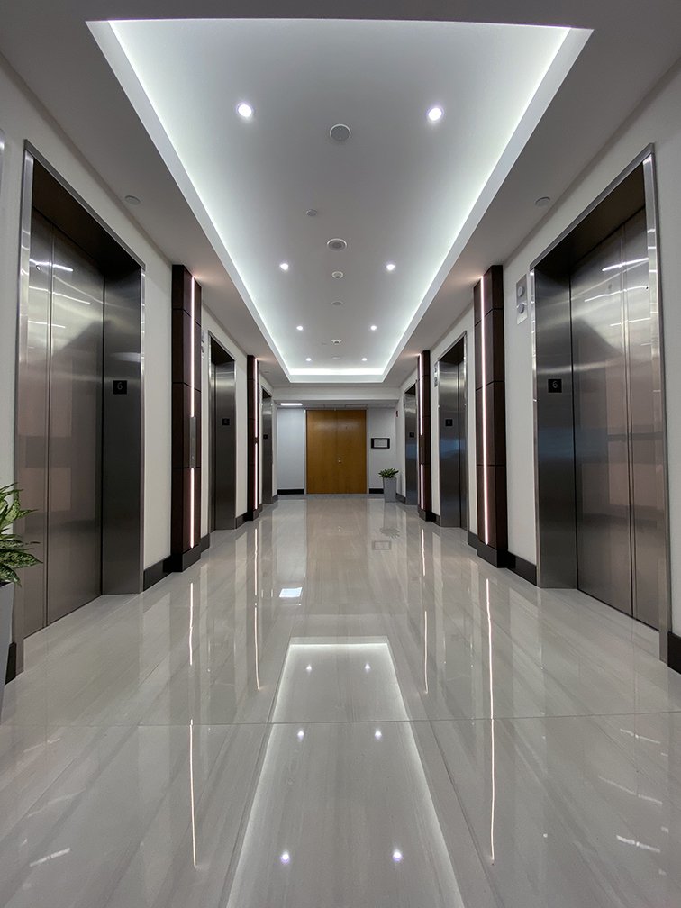 LED Pilasters made for ProFi. Wenge columns with blackened aluminum edging. Made for five floors of an office building