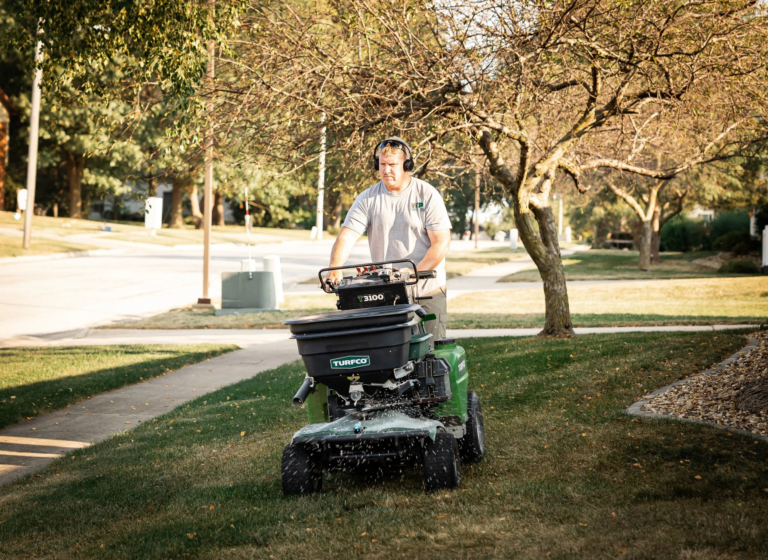 Wapsie Pines Employee Applying Fertilizer