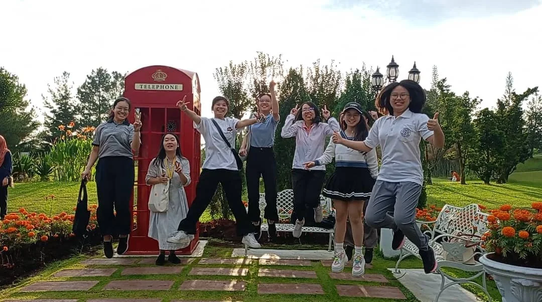 Sisters jumping at the English Garden