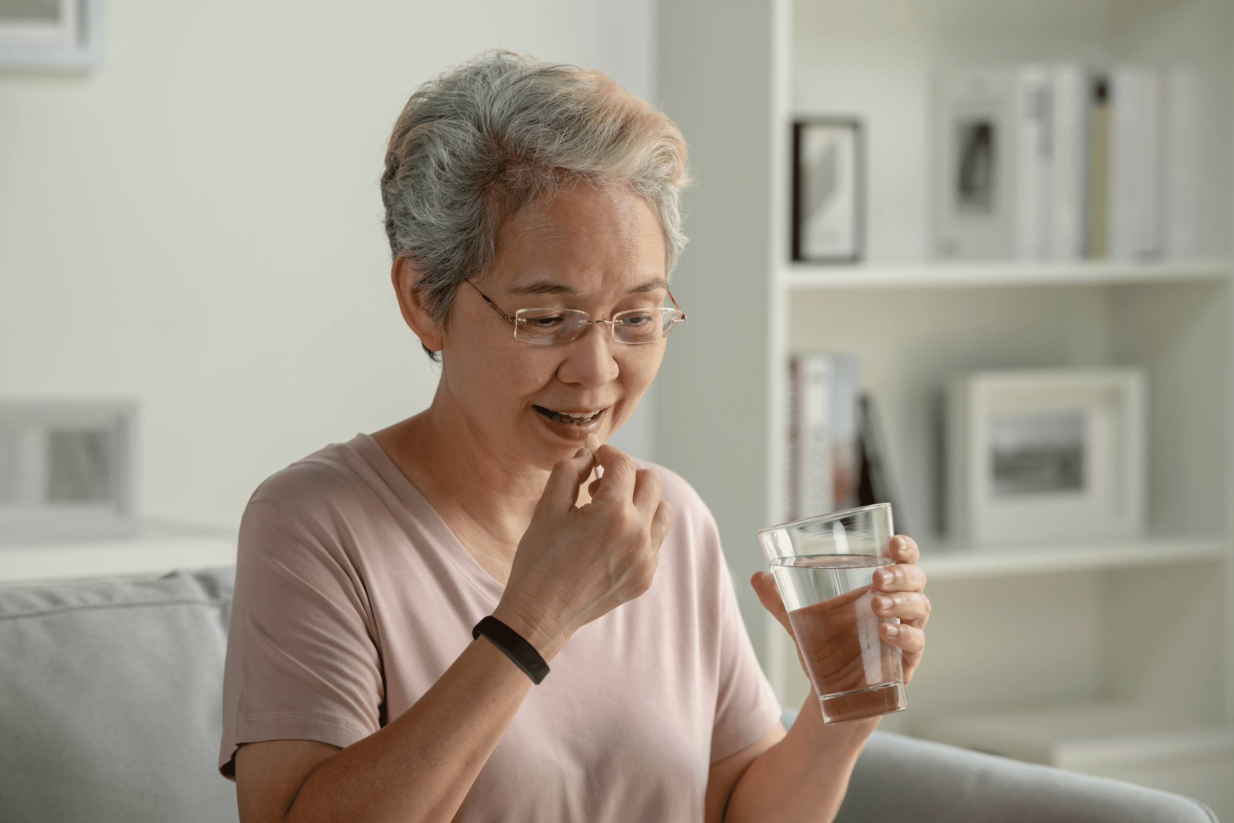 Woman taking meds.png
