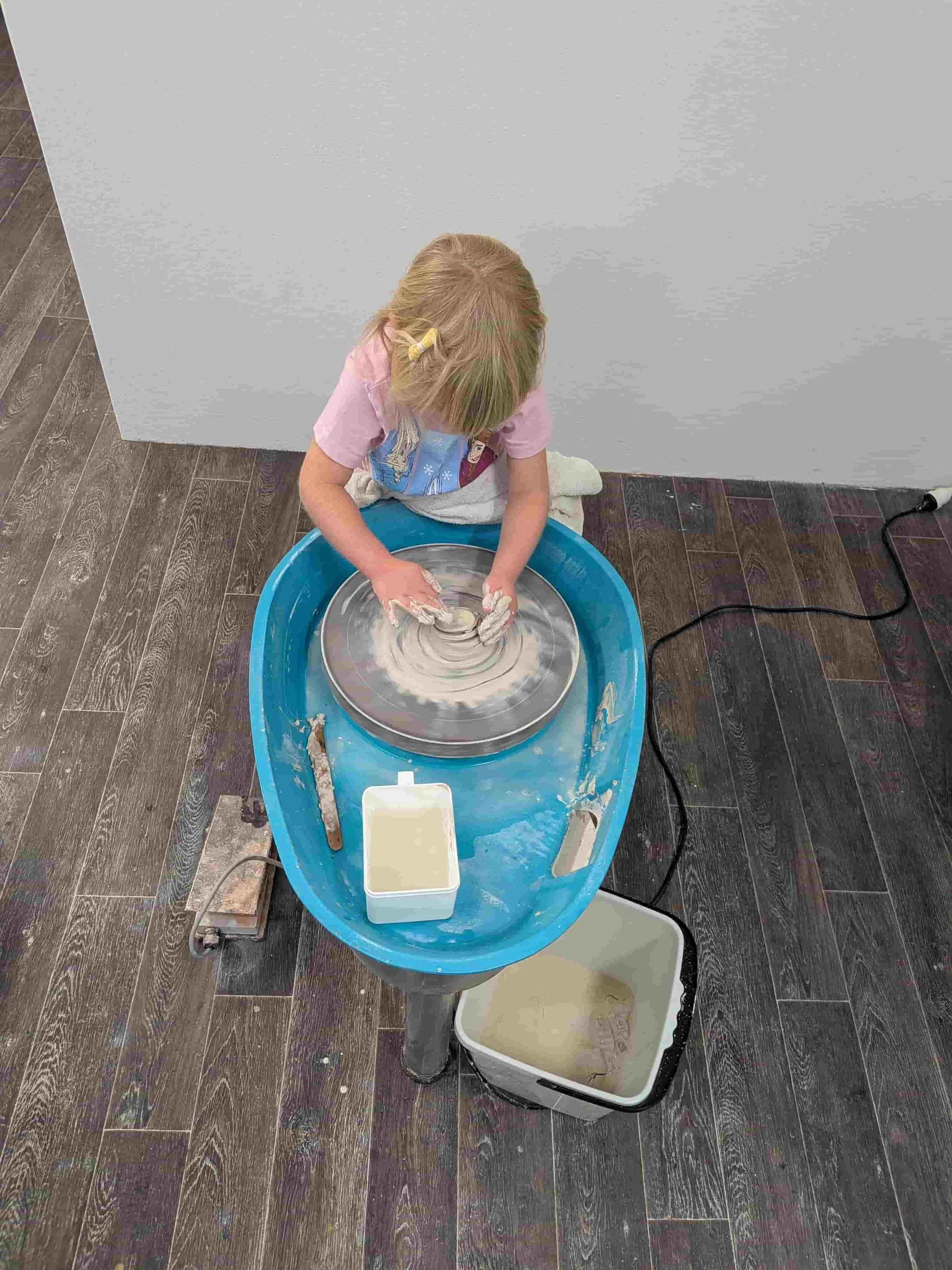 Kids on the potters wheel at from dust studio