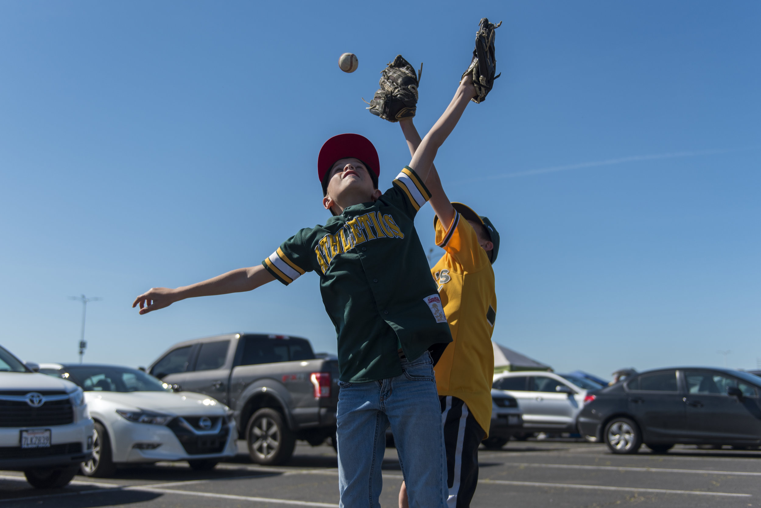  Chase (left) and Dash Dutcher play in the Oakland Coliseum parking lot before the A’s play the L.A. Angels on Thursday, March 29, 2018. | Rosa Furneaux, Special To The Chronicle 