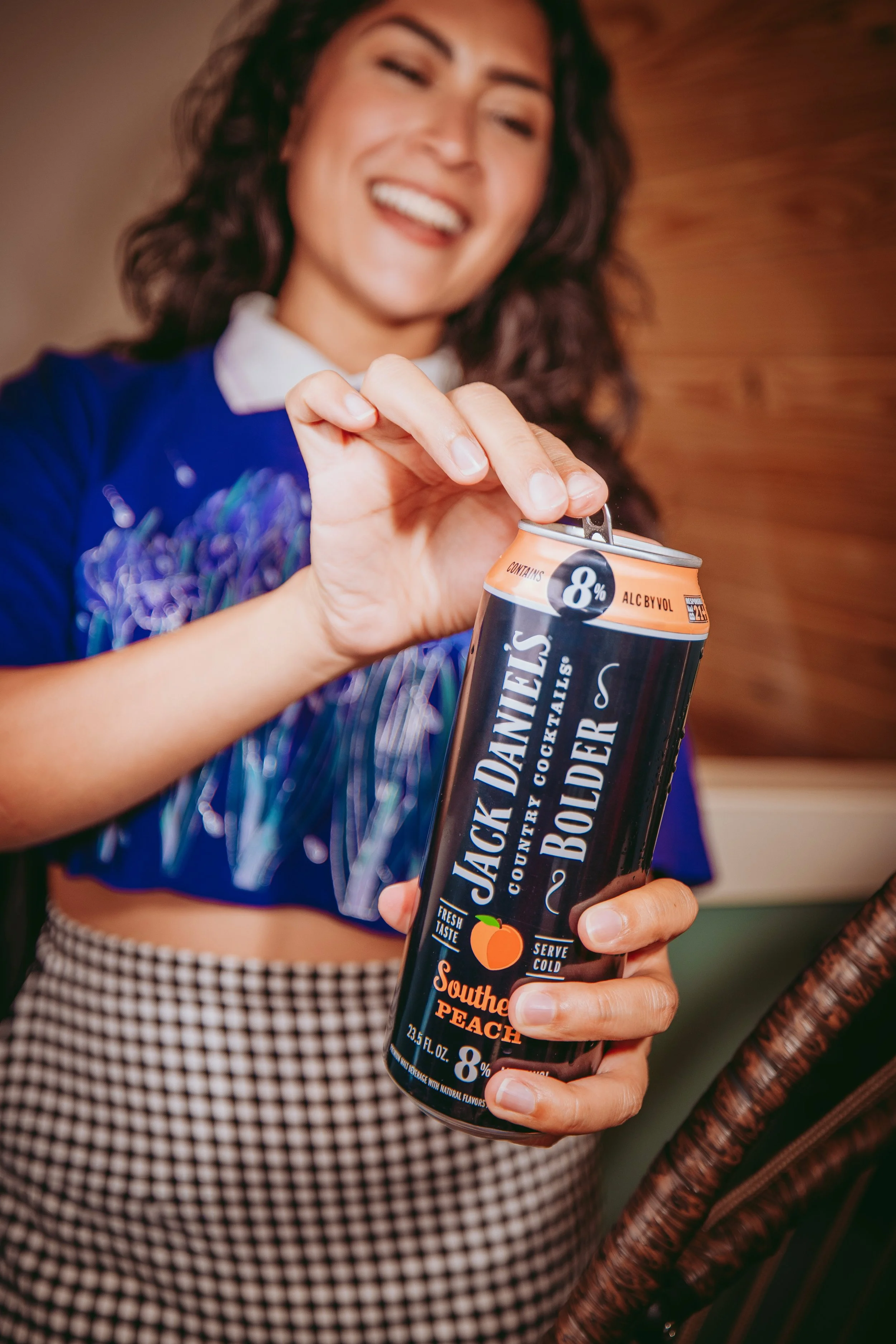 Commercial lifestyle beverage and food product photography featuring Gen Z and millennial talent interacting with a ready-to-drink cocktail, using candid motion, natural expression, and clean composition to create an eye-catching, high-impact image.