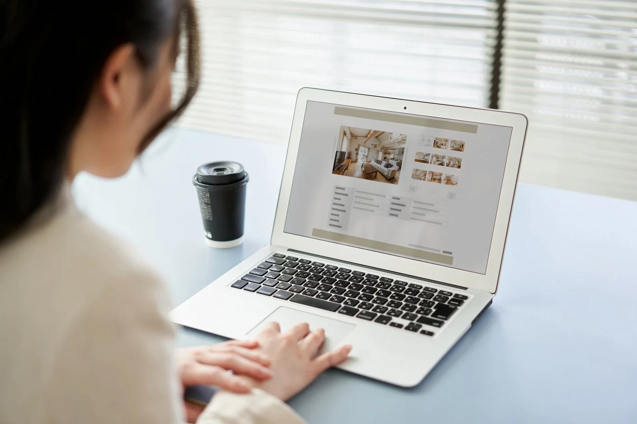 Therapist reviewing her therapy website after completing a new certification to update her marketing