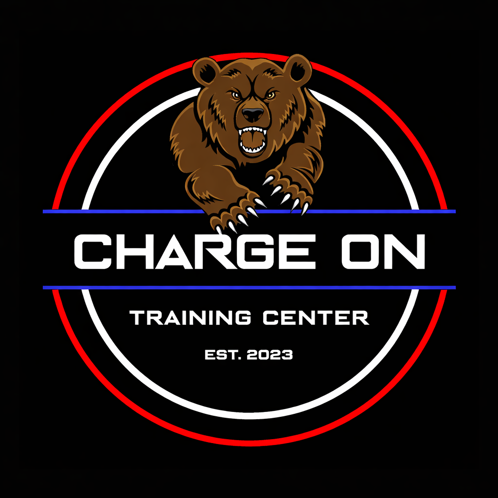 A logo for 'Charge On Training Center' featuring a fierce brown bear with claws extended, inside red, white, and blue concentric circles on a black background.