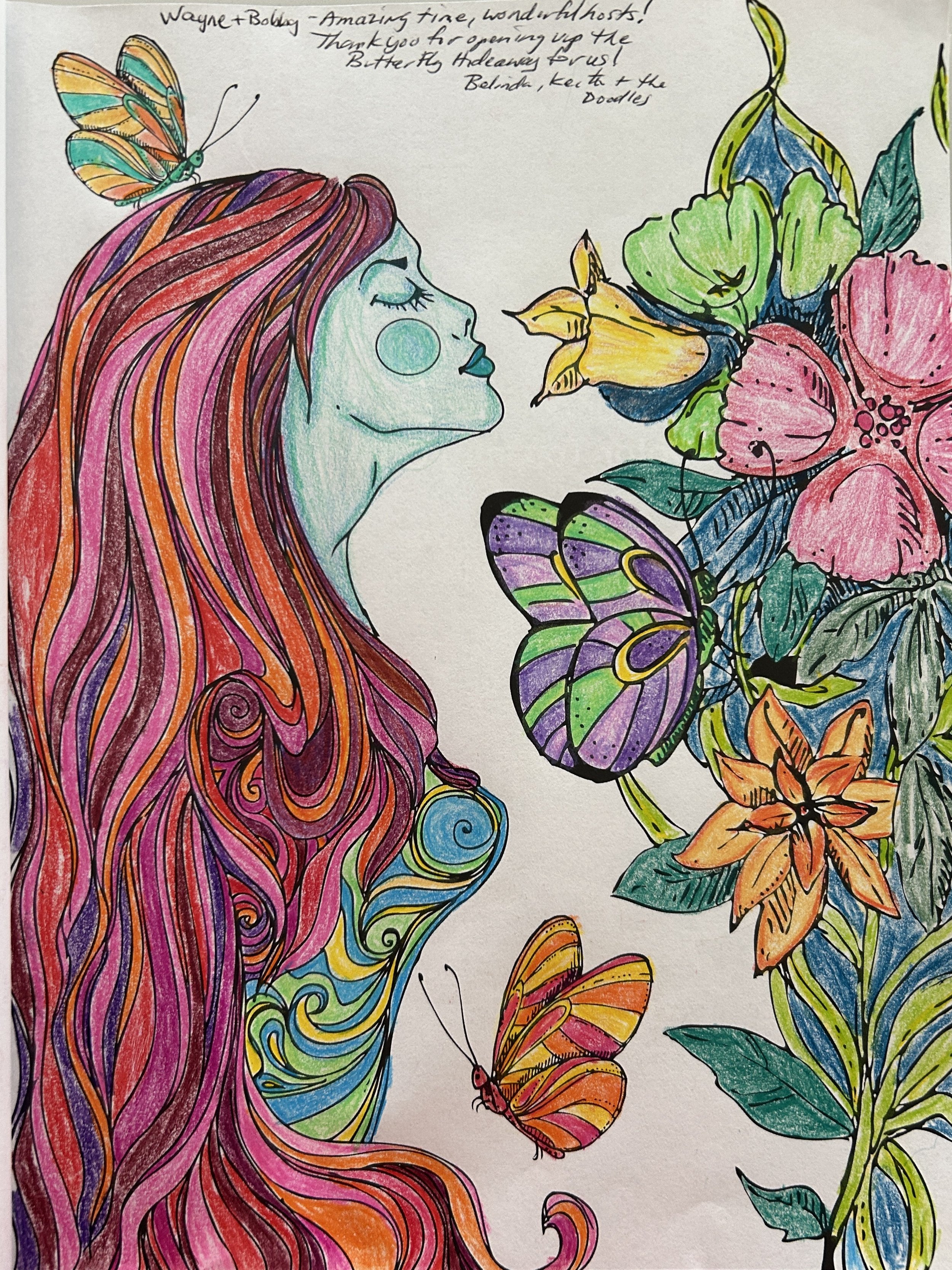 Colorful drawing of a woman with long, flowing pink and orange hair, surrounded by vibrant butterflies and flowers, with handwritten notes at the top.