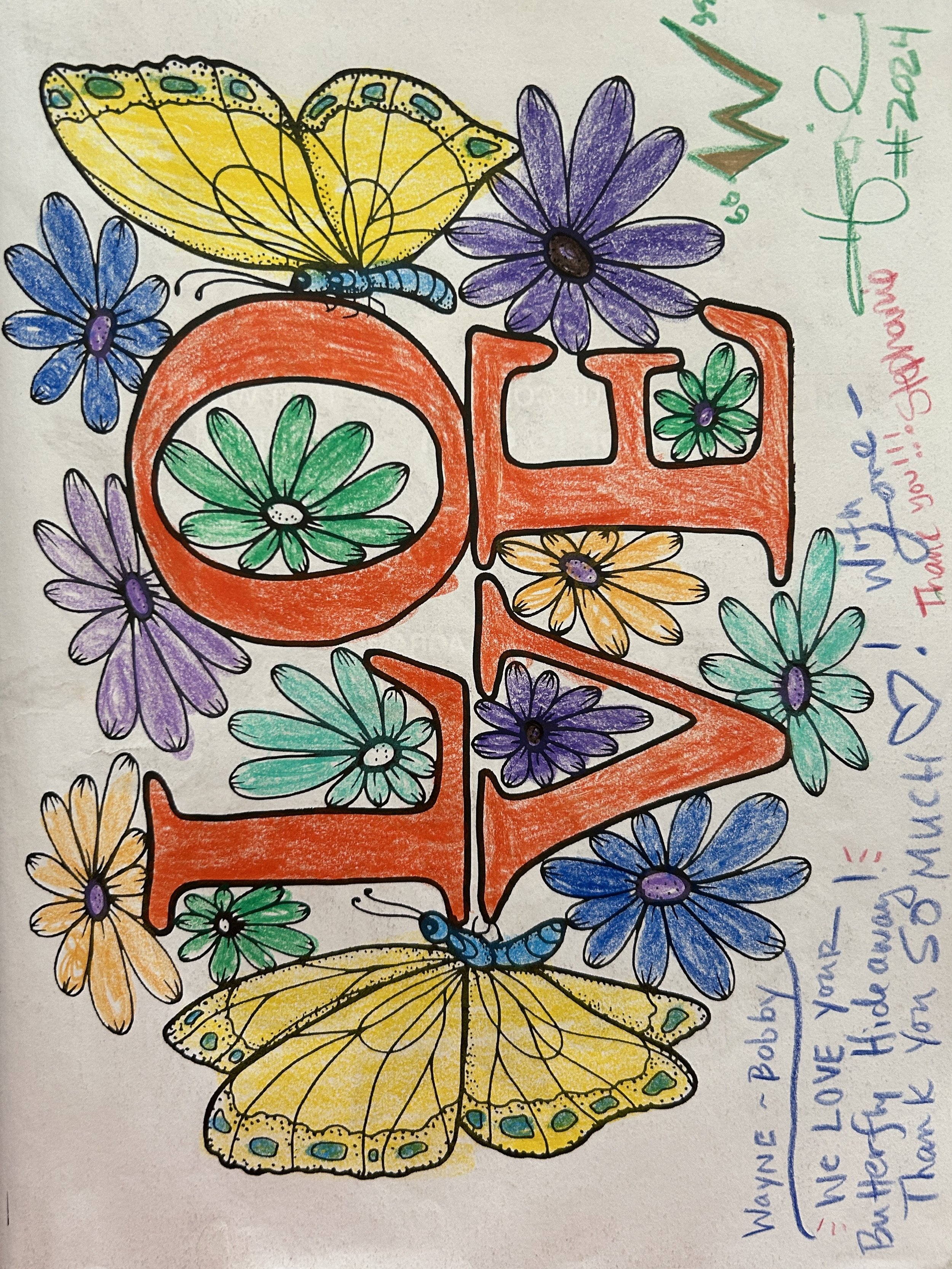 Colorful hand-drawn art with the word LOVE in large letters, decorated with green, purple, yellow, and orange flowers and two yellow butterflies, with a handwritten message to someone named Wayne.