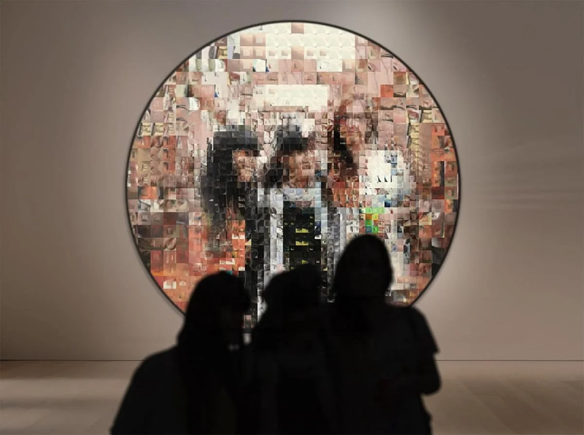 Three silhouetted people sit in front of a large round mirror-like screen that seems to reflect back their pixelated reflections
