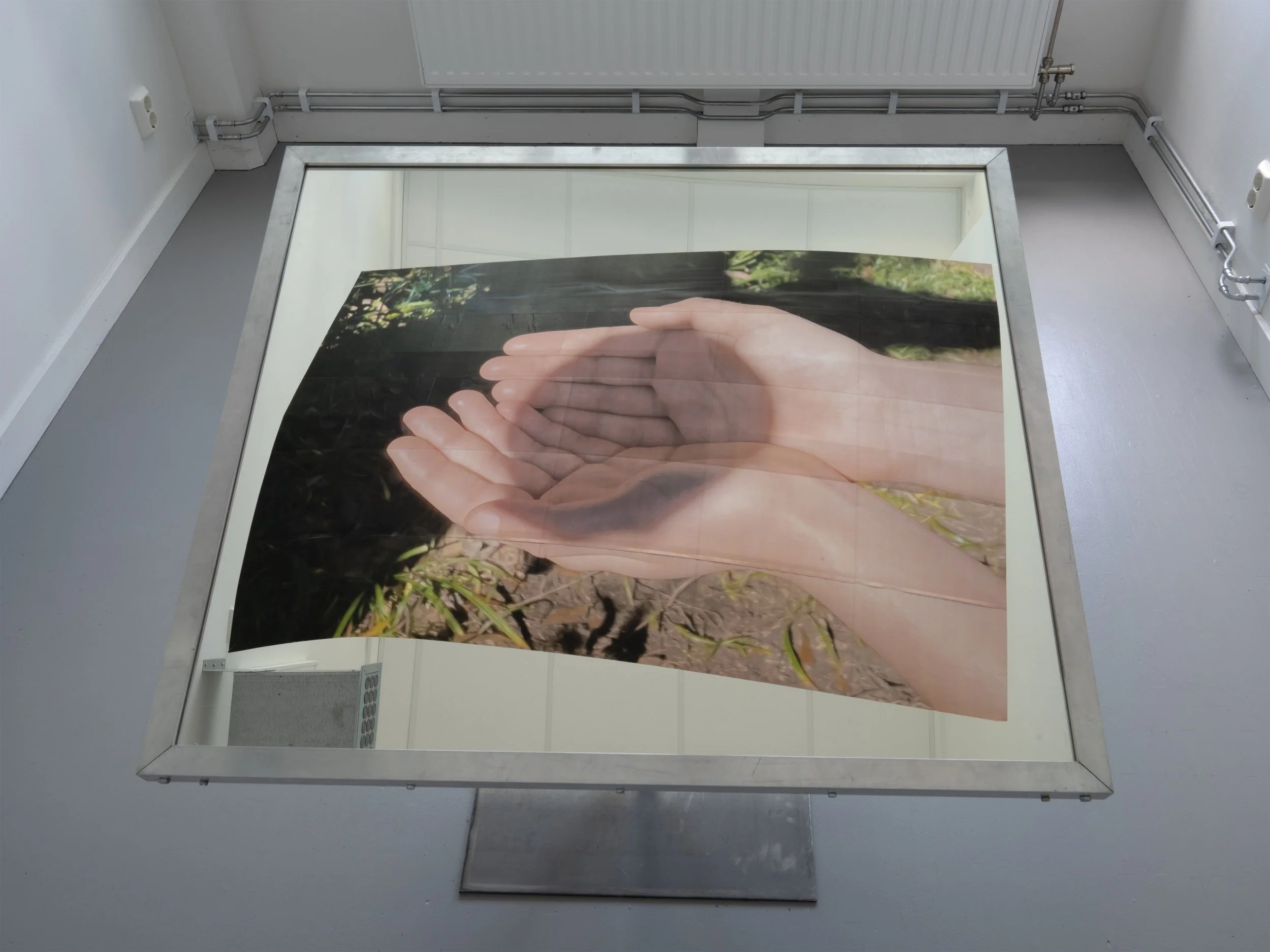 Evidence (installation view), 2025, glass mirror, aluminum, steel, laserjet prints, board, open window