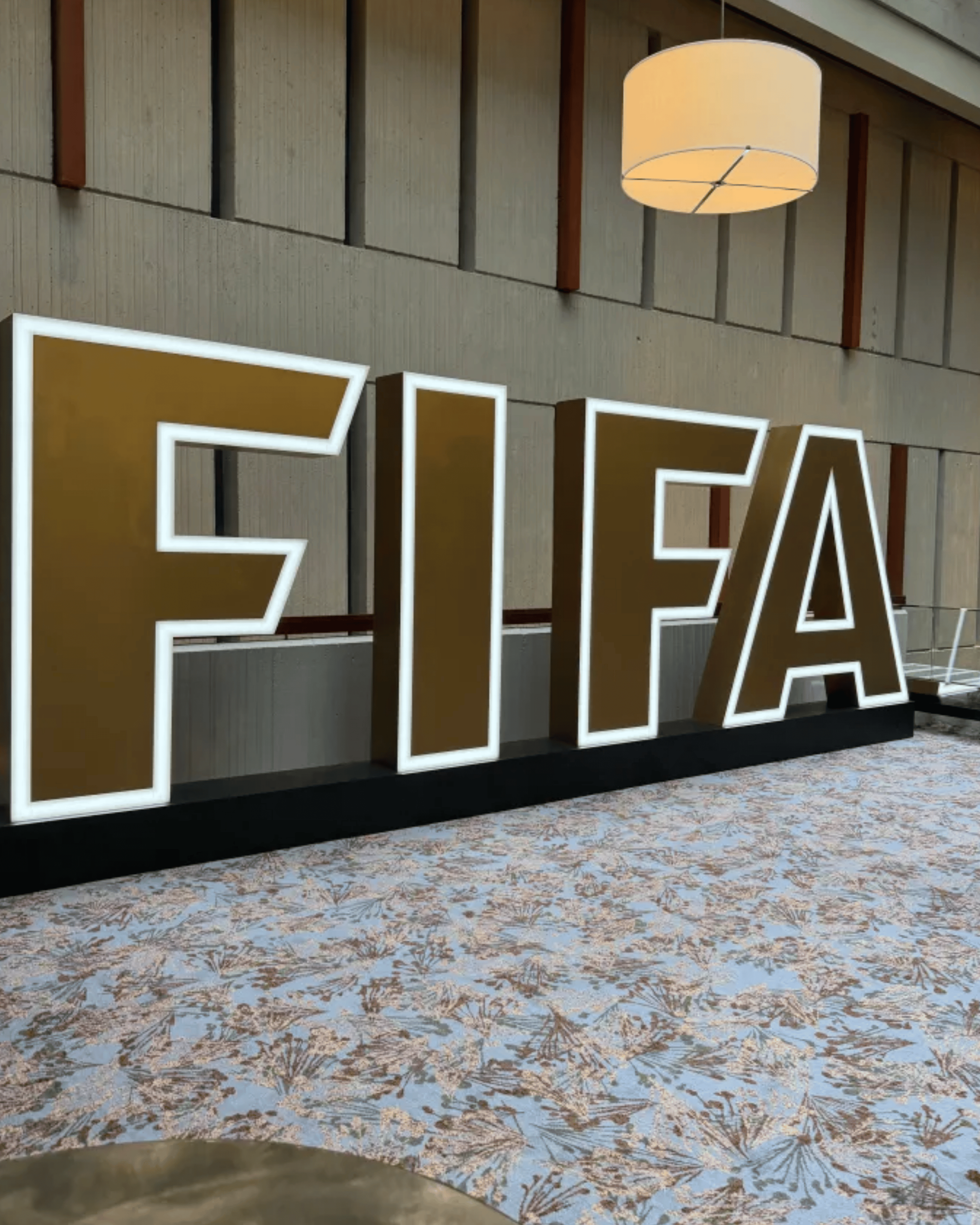 Geometric drawing of an outline square with sections divided by vertical, horizontal, and circle lines.