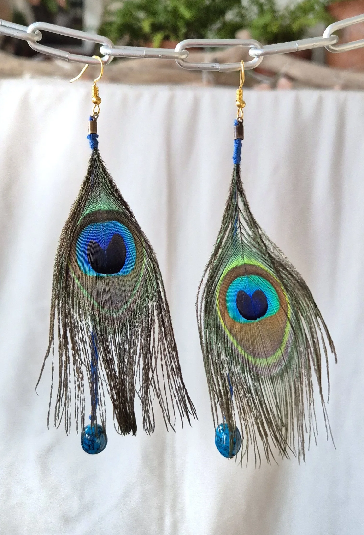 Peacock feather blue earrings.jpg