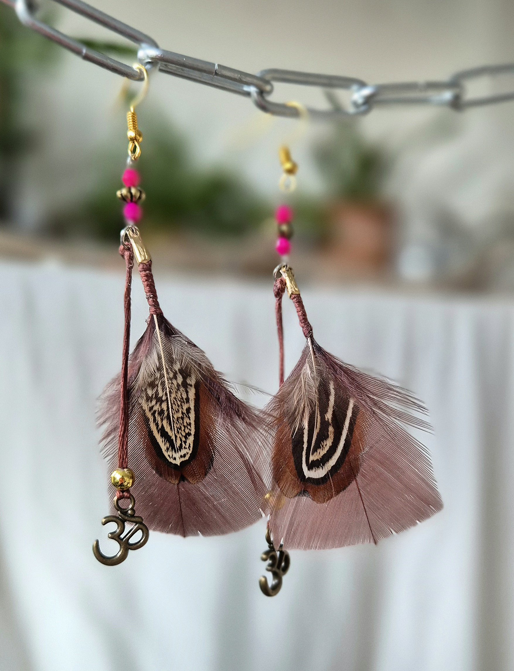 Brown feather om earring.jpg