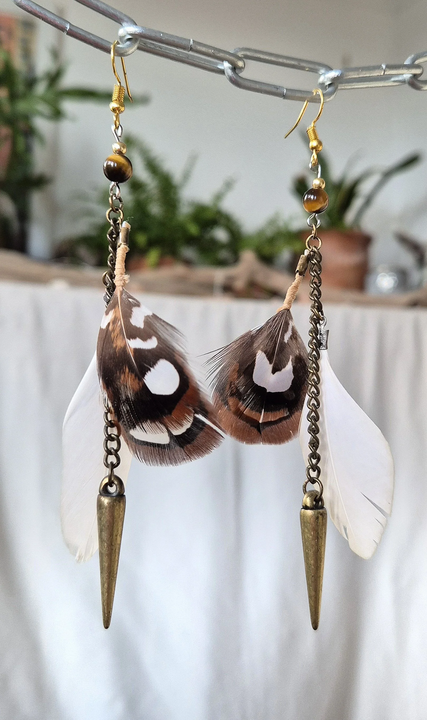 Bronze white feather boho earring.jpg