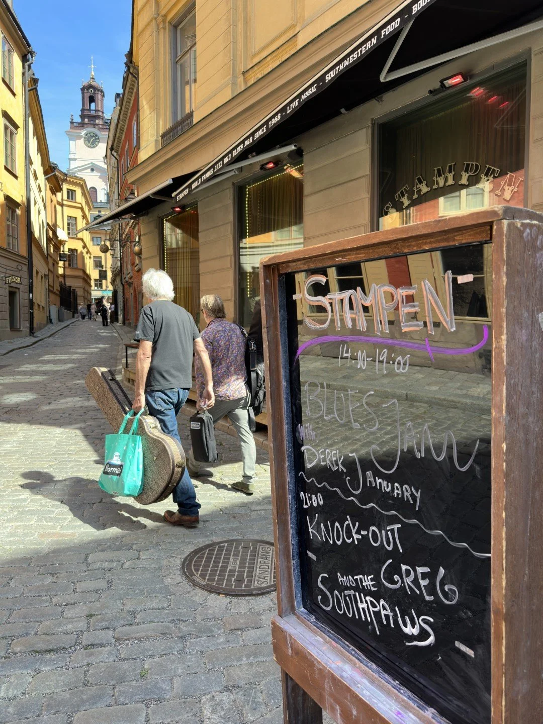 Musicians arriving for the Stampen Blues jam in old town, which has been going on since 2003