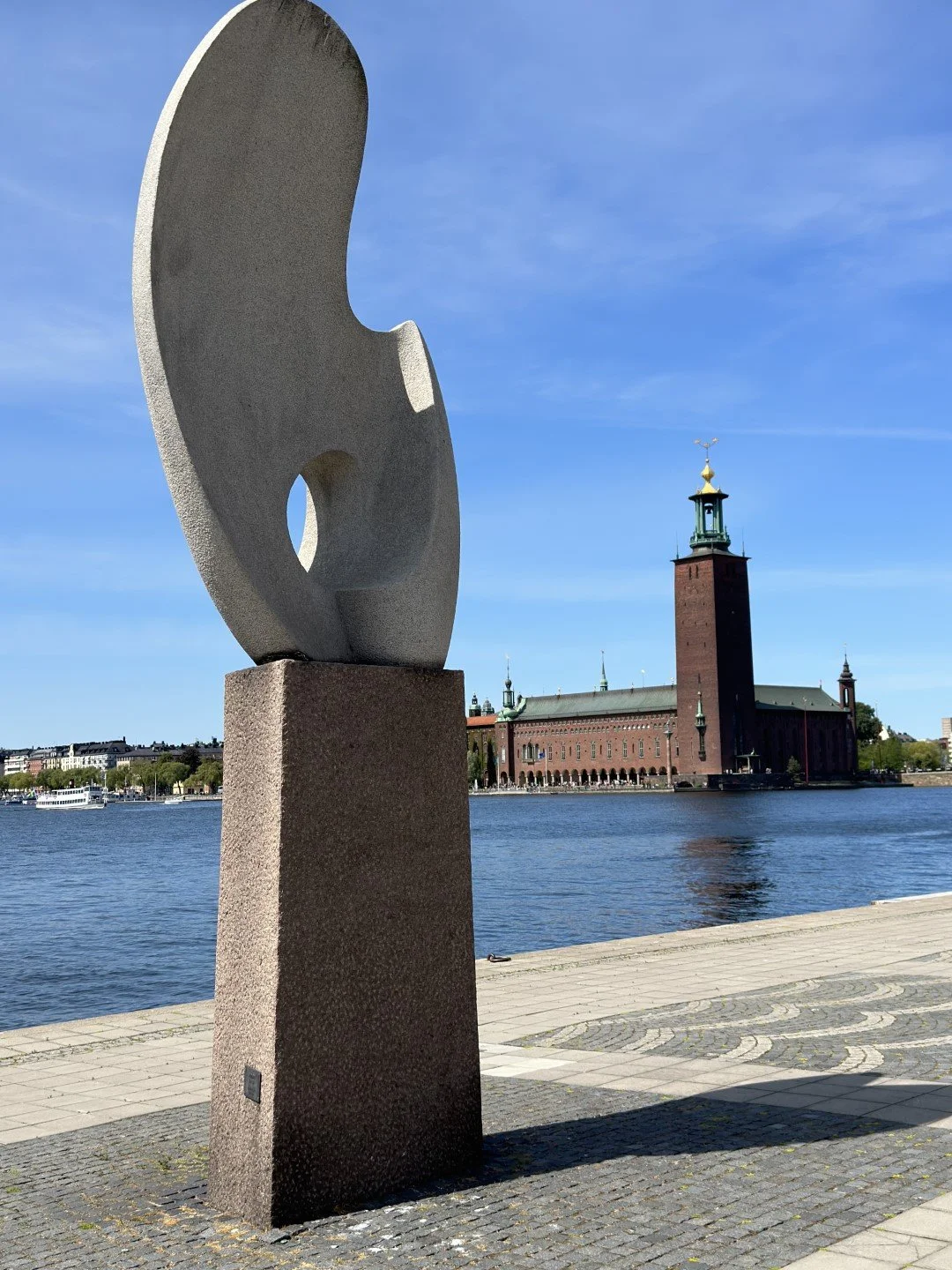 Solbaten, (Sun Boat), sculpture with Stadshuset, (City Hall).