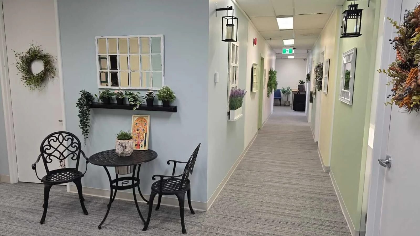 welcoming assessment office hallway with bright colours and cafe dining set