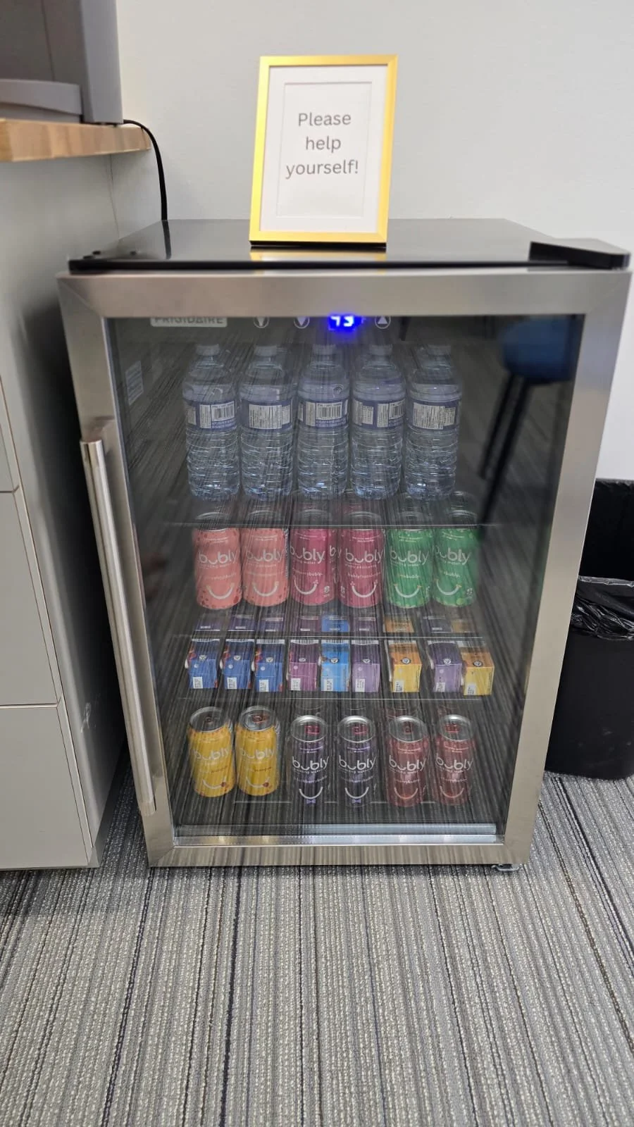 Free water, bubbly, and juice boxes for clients in reception at Embark Psychology Calgary clinic