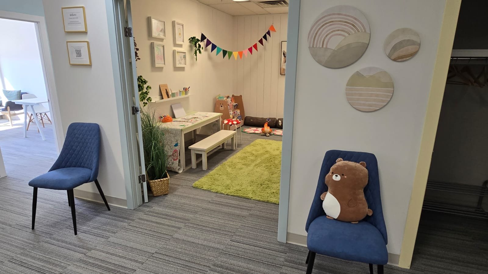 Reception area at Embark Psychology Calgary clinic leading into a fun and welcoming child-friendly playroom