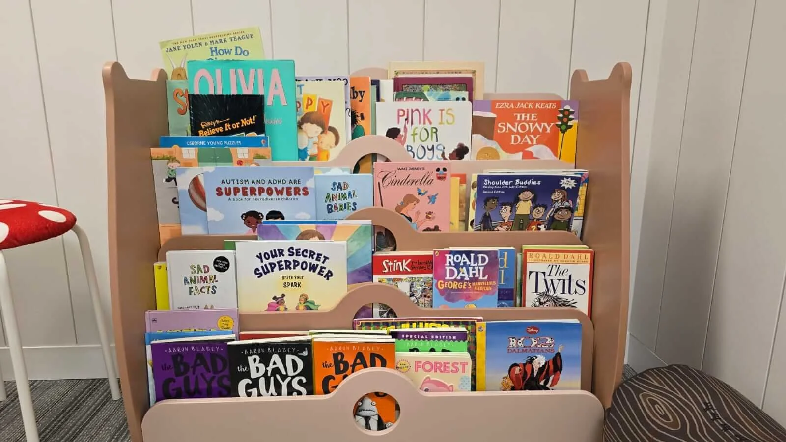 Variety of kids books with all reading levels in playroom at Embark Psychology Calgary