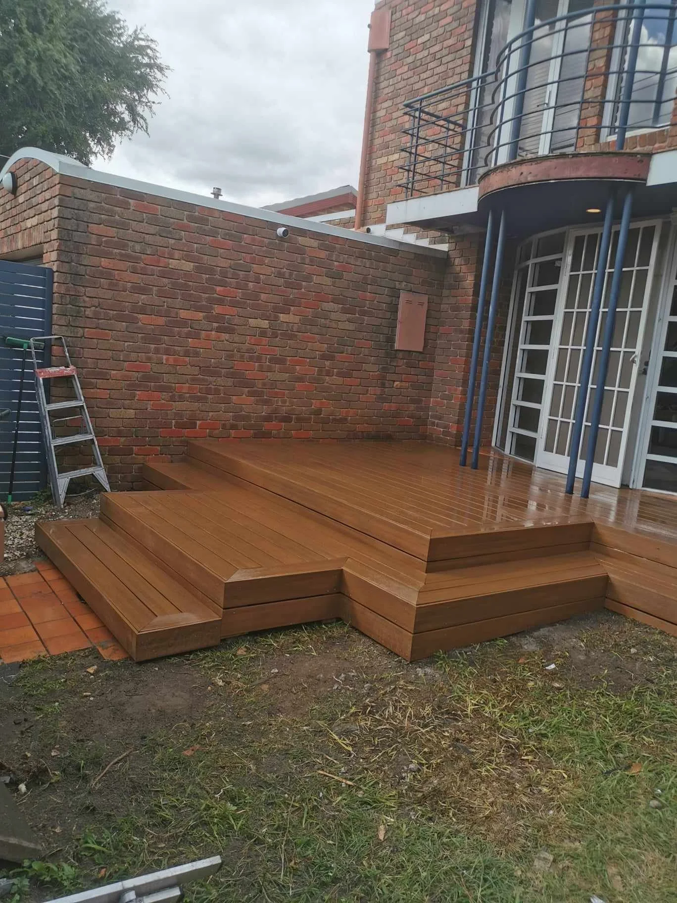 Composite decking, tiered stepping, on a front veranda. Penrith decking projects. 