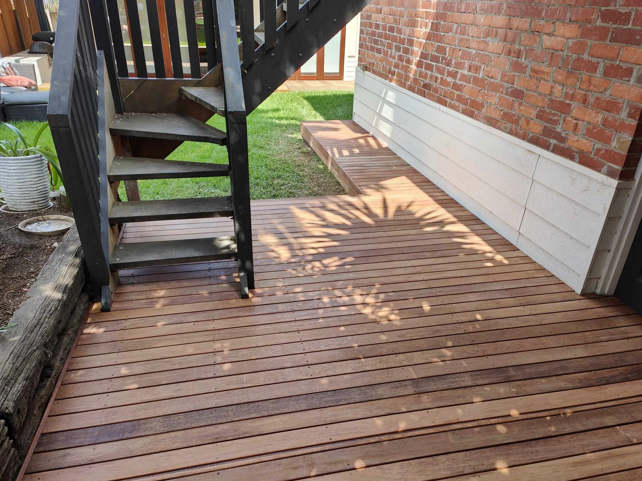 Merbau decking with step. Curated and crafted just for this space. Penrith decking solutions. 