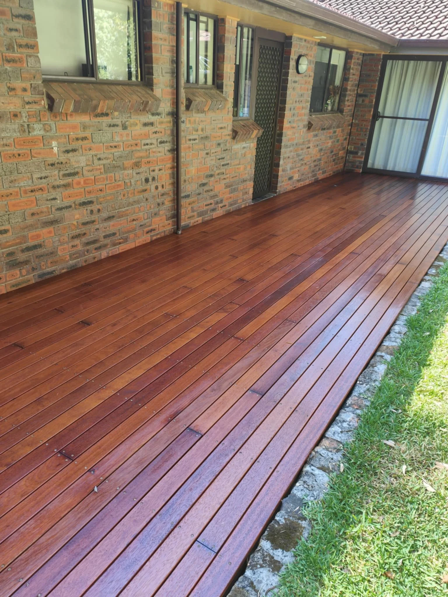 Timber Decking complete with sand and oil. Timber decking builder. 