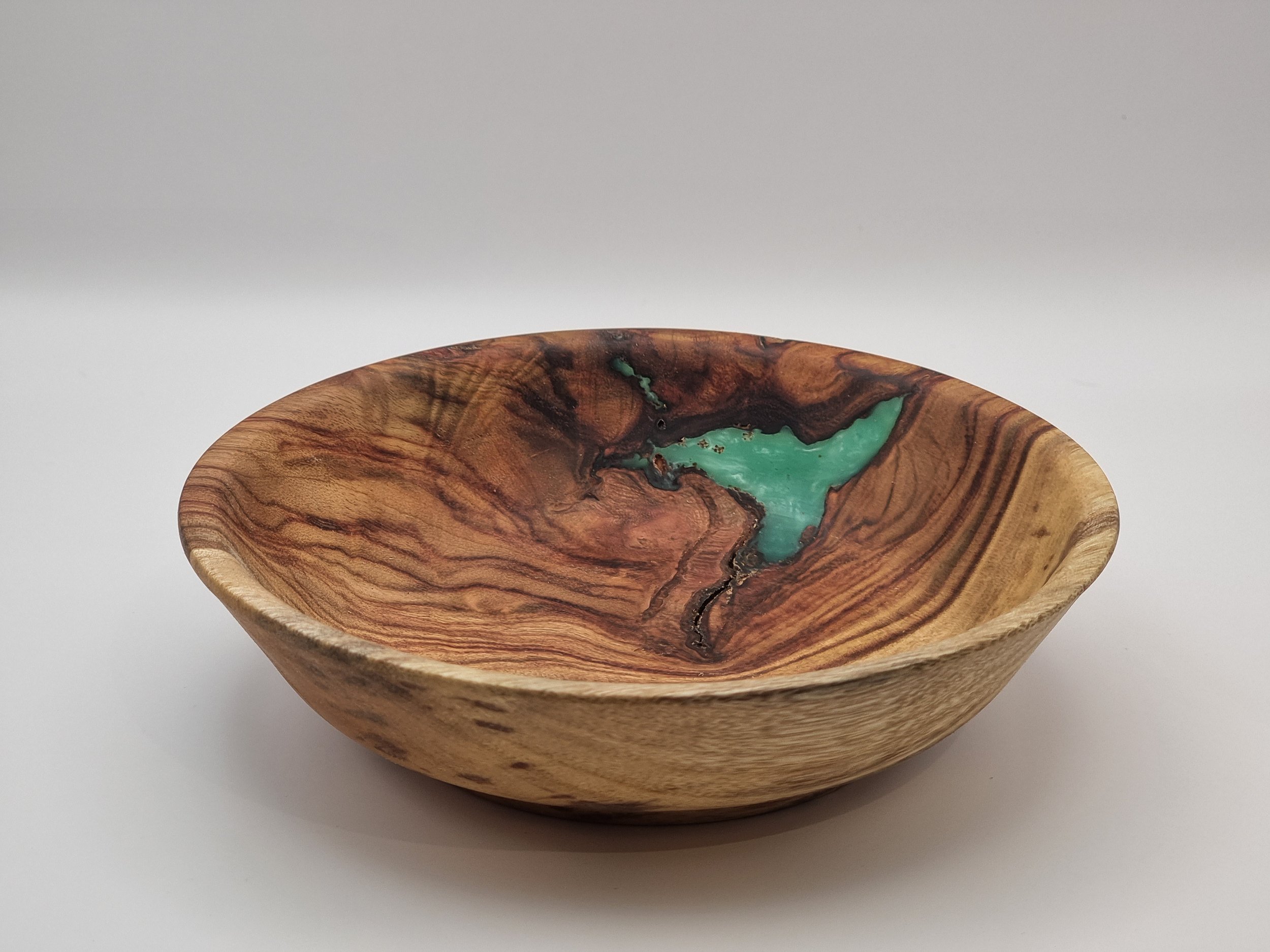 Wooden bowl with turquoise inlay design