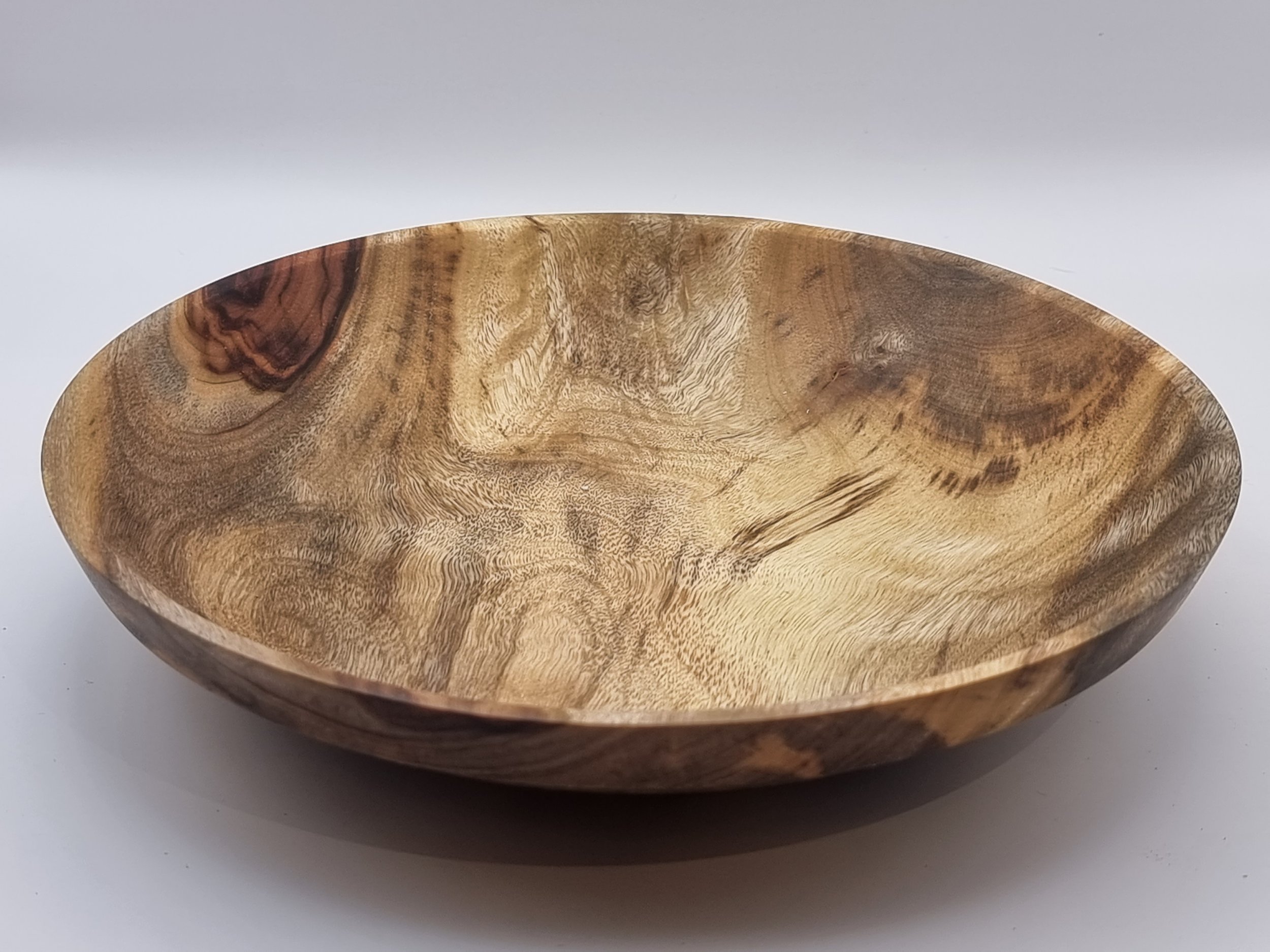 Wooden bowl with natural grain pattern