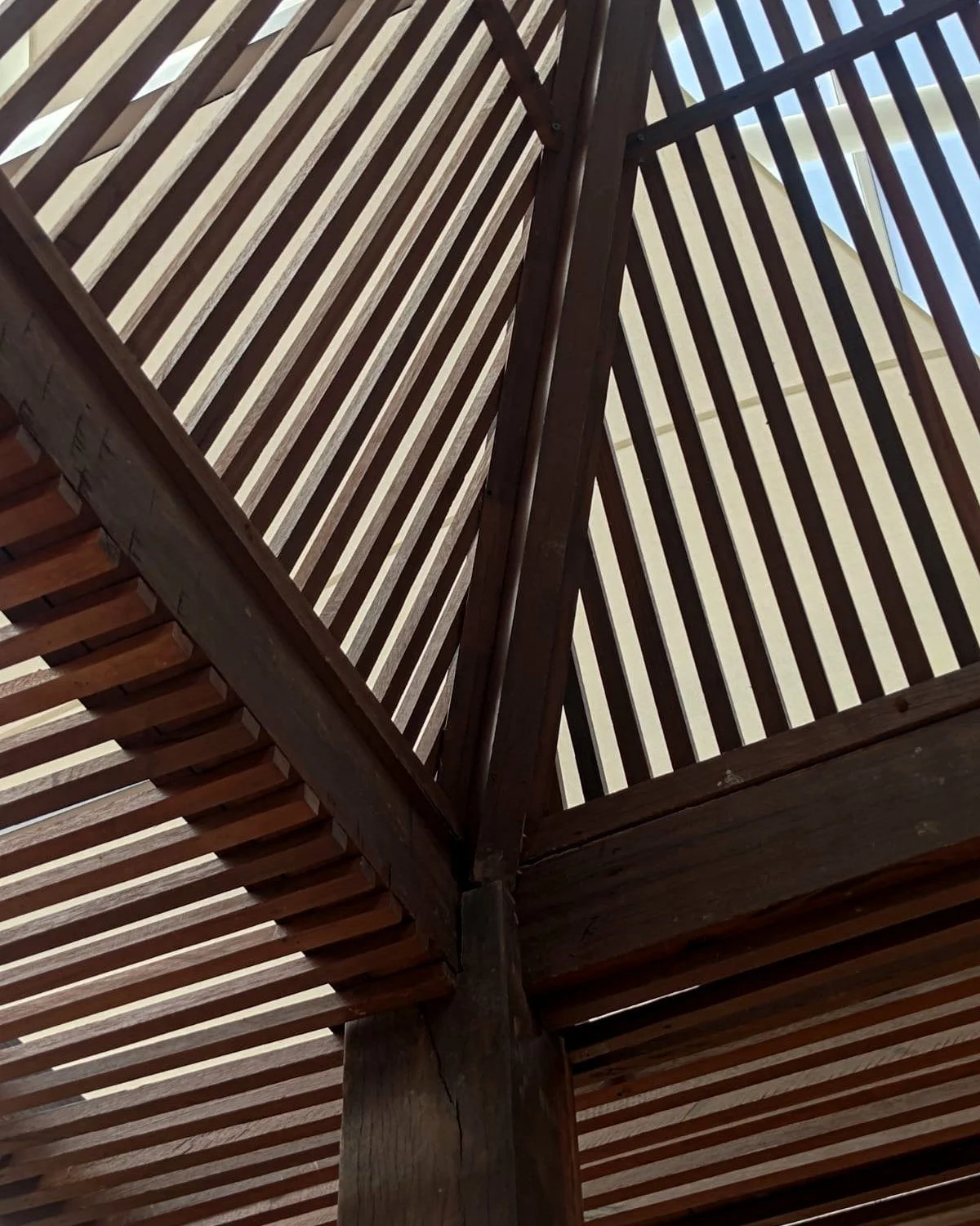 Every great space starts with the small things: the grain, the edges, the way pieces meet.

The first slides zoom in on the craft behind this reclaimed wood pergola&mdash;then swipe to the last photo to see the full reveal: installed at Seminyak Vill