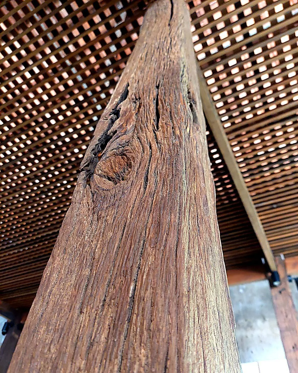 Once a bridge pillar. Now part of a new structure.

This reclaimed ironwood (ulin) column spent decades standing in water, supporting a bridge. The marks, cracks, and deep grain are not imperfections &mdash; they are the record of that life.

Today i
