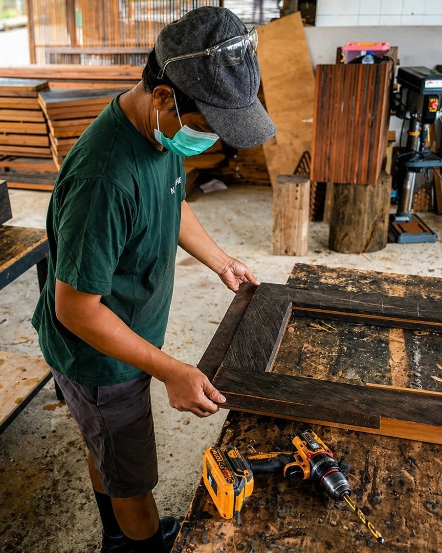 Most people only see the finished window.
They never see the hands that give it a second life.

Here, reclaimed ironwood is being crafted into a custom window frame &mdash; turning timber from old structures into something purposeful, durable, and be