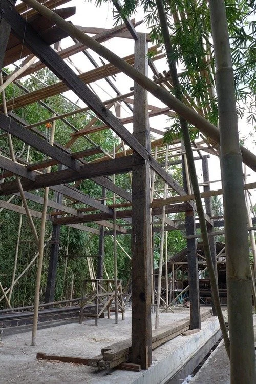 House under construction with reclaimed Ulin structural framework