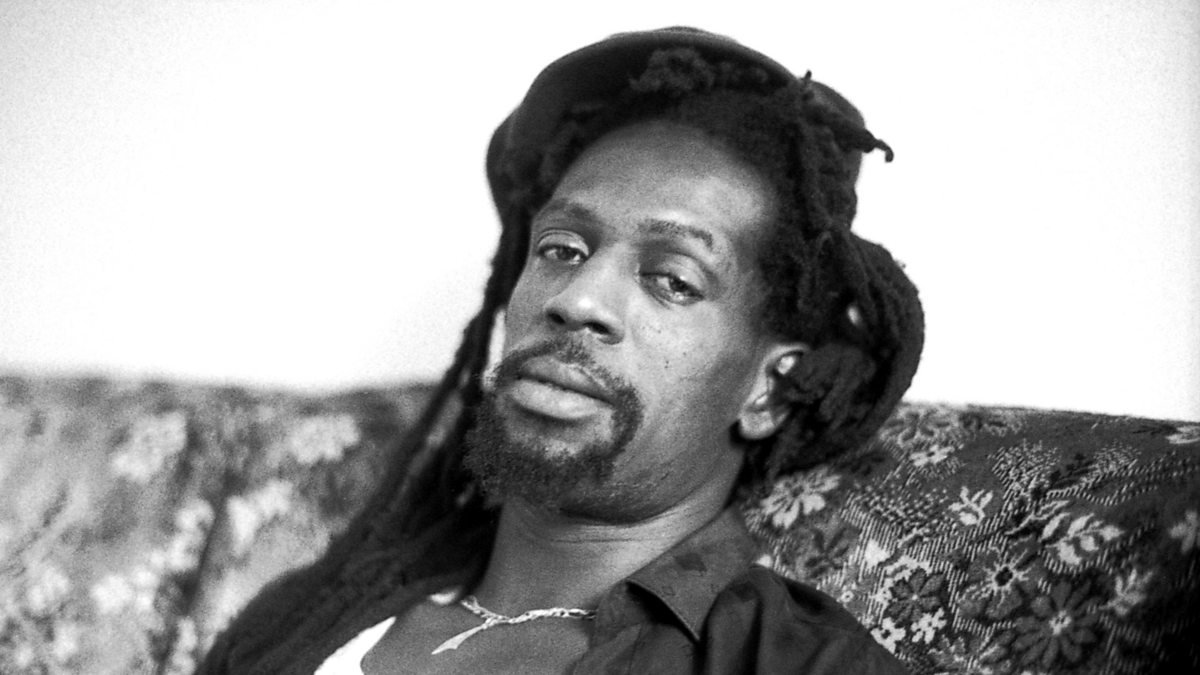 Greogry Issacs relaxing on a sofa.