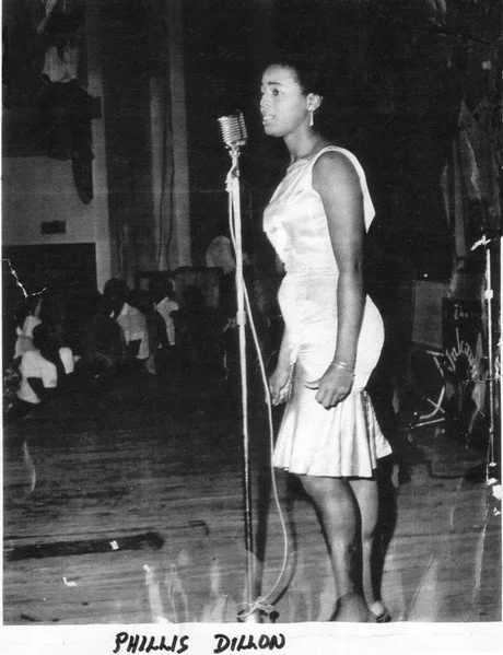 Black-and-white image of Phyllis Dillon performing live