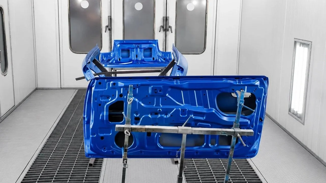 SUBARU WRC P2000 PROJECT PARTS IN PAINT BOOTH