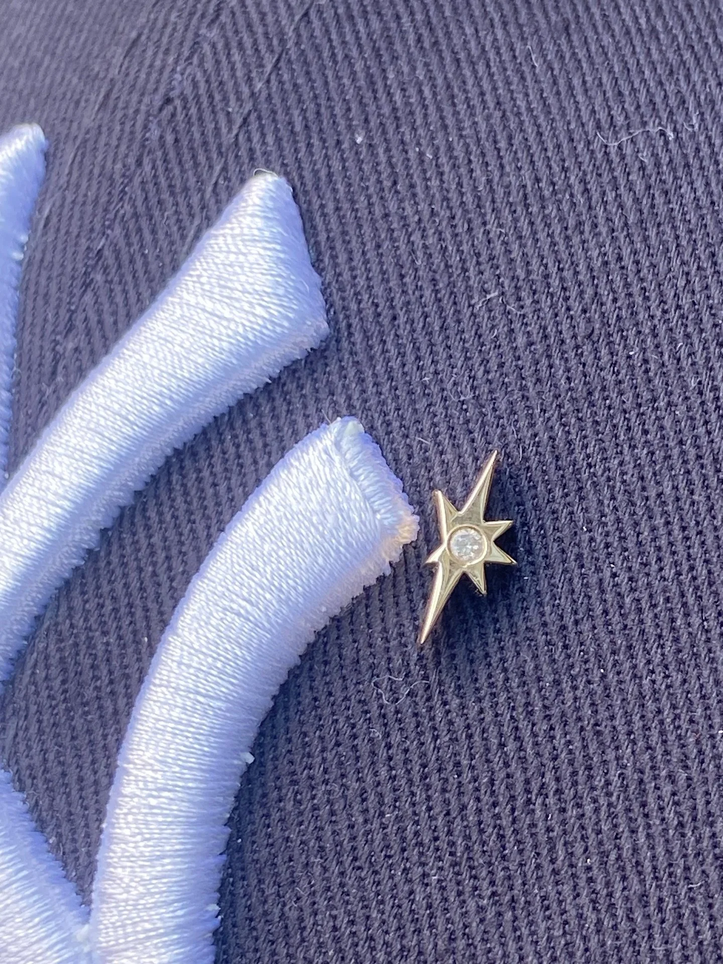 Yellow gold and diamond hat pin, available on request.