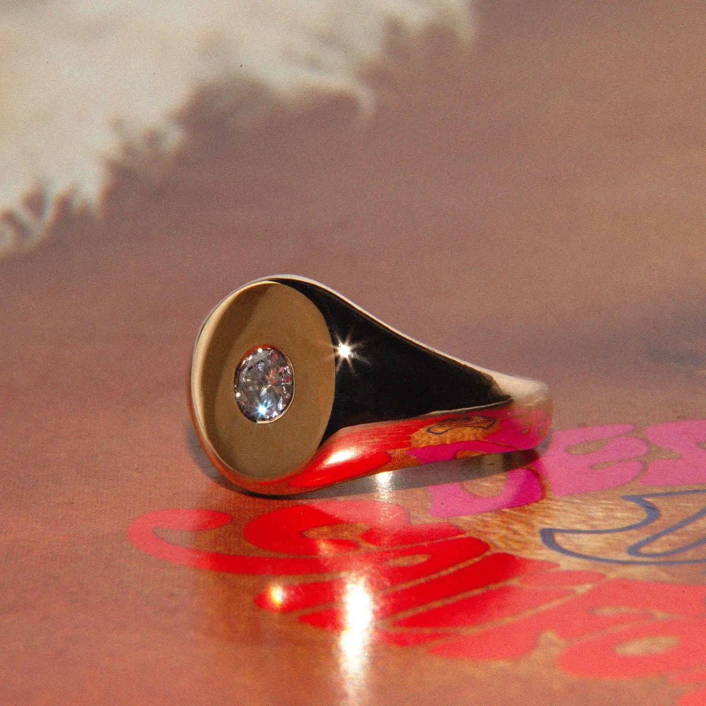 Heavyweight oval signet, set with a 0.3ct old European cut diamond.