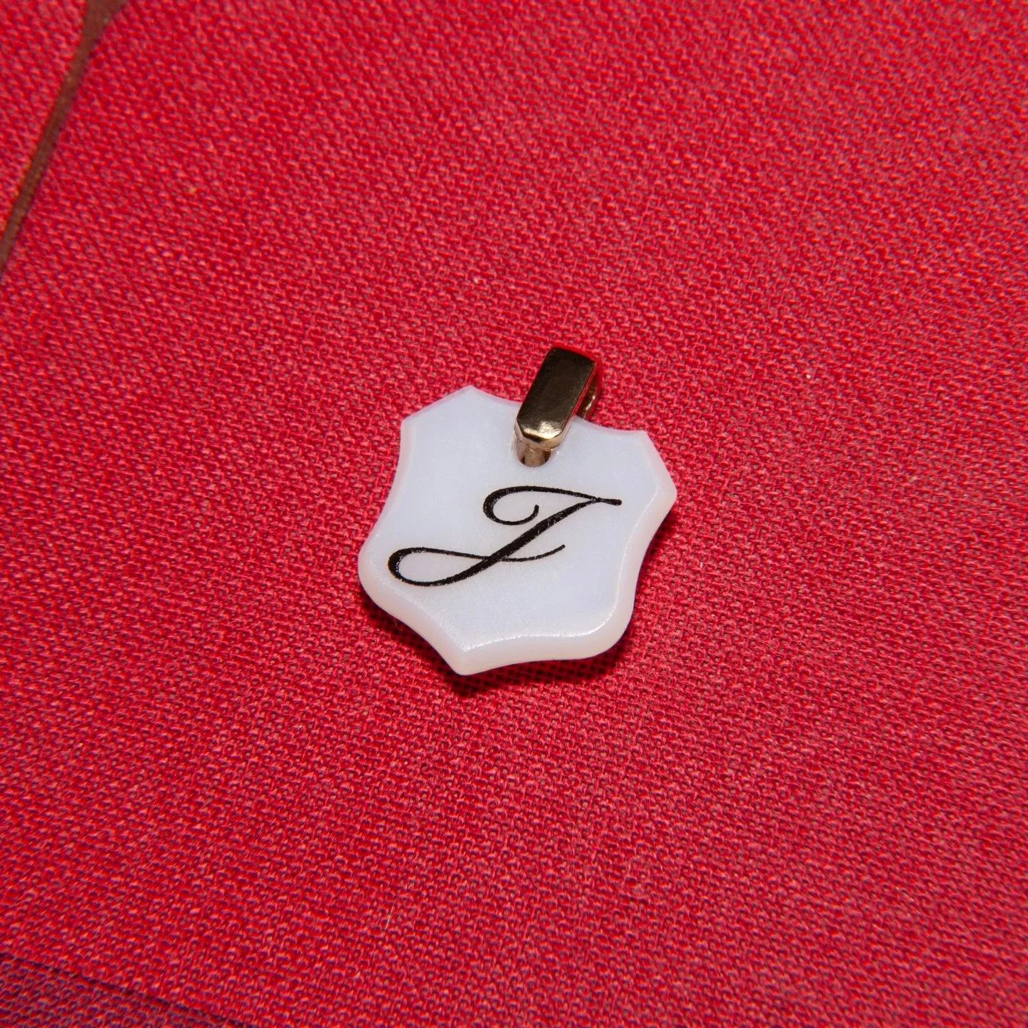 Sardonyx pendants.
Made from antique sardonyx shields, sourced from vintage signet rings. Each piece is carefully drilled and deep engraved with your chosen words, letters, or numbers and the option of coloured cold enamel detailing. Finished with a 